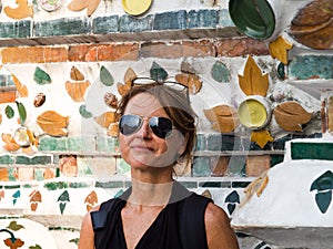 Beautiful portrait of a woman with sun glasses at Wat Arun, Bangkok, Thailand