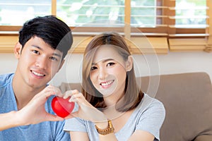 Beautiful portrait young asian couple gesture holding heart shape together