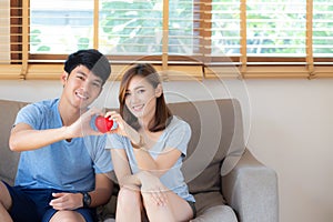 Beautiful portrait young asian couple gesture holding heart shape together, man and woman cheerful smiling and happy
