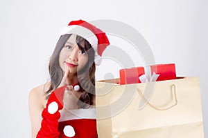 Beautiful portrait young asian woman happy and excited holding paper bag with gift box in xmas holiday 