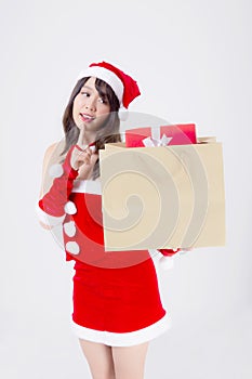 Beautiful portrait young asian woman happy and excited holding paper bag with gift box in xmas holiday isolated