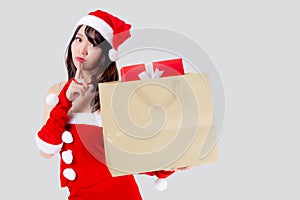 Beautiful portrait young asian woman happy and excited holding paper bag with gift box in xmas holiday isolated.