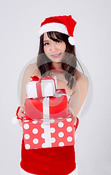 Beautiful portrait young asian woman happy holding lot of gift box with excited in xmas holiday isolated