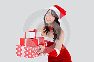 Beautiful portrait young asian woman happy holding lot of gift box with excited in xmas holiday isolated.