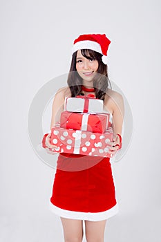 Beautiful portrait young asian woman happy holding lot of gift box with excited in xmas holiday  on white background