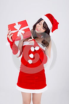 Beautiful portrait young asian woman happy holding red gift box with excited in xmas holiday isolated on white background