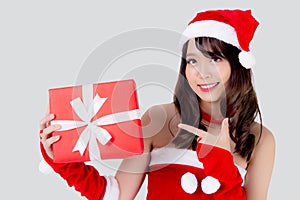 Beautiful portrait young asian woman happy holding red gift box with excited in xmas holiday isolated on white background.