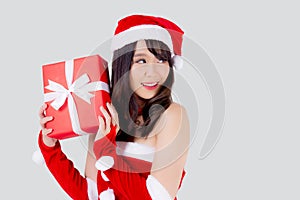 Beautiful portrait young asian woman happy holding red gift box with excited in xmas holiday isolated on white background.