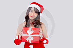 Beautiful portrait young asian woman happy holding red gift box with excited in xmas holiday isolated on white background.