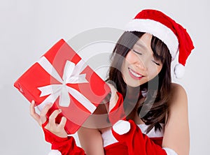 Beautiful portrait young asian woman happy holding red gift box with excited in xmas holiday  on white background
