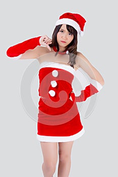 Beautiful portrait young asian woman Santa costume gesture thumbs down sign with unhappy negative in holiday xmas.