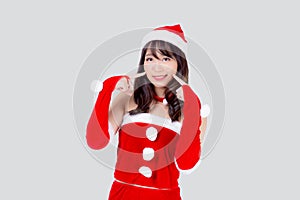 Beautiful portrait young asian woman Santa costume wear hat smiling with happy in holiday xmas.