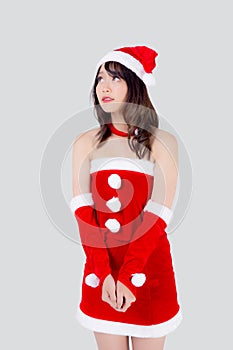 Beautiful portrait young asian woman Santa costume wear hat smiling and thinking in holiday xmas.