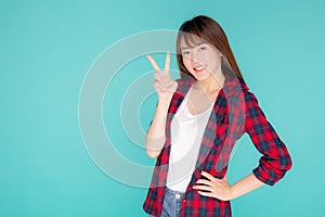 Beautiful portrait young asian woman smiling confident and excited summer holiday isolated blue background