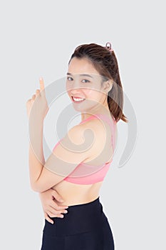 Beautiful portrait young asian woman in sport clothes with satisfied and confident isolated on white background