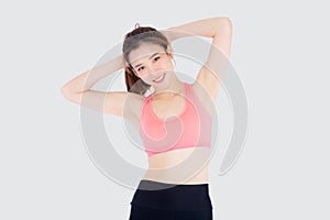 Beautiful portrait young asian woman standing stretch muscle arm  on white background