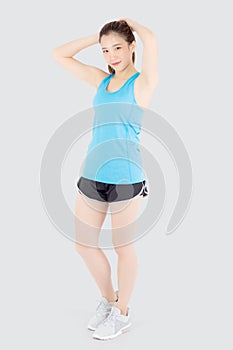 Beautiful portrait young asian woman standing workout stretch muscle arm with healthy isolated on white background