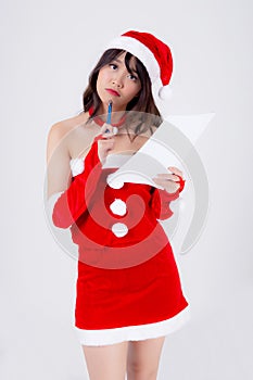 Beautiful portrait young asian woman thinking and writing notepad in xmas day isolated on white background