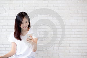 Beautiful of portrait young asian woman touch phone and smile st