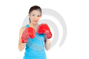 Beautiful portrait young asian woman wearing red boxing gloves with strength and strength isolated on white background