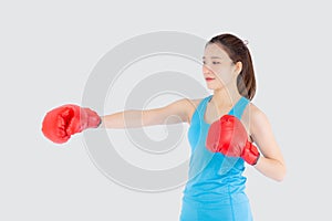 Beautiful portrait young asian woman wearing red boxing gloves with strength and strength isolated on white background