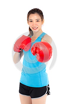 Beautiful portrait young asian woman wearing red boxing gloves with strength and strength isolated on white background, girl