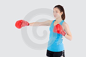 Beautiful portrait young asian woman wearing red boxing gloves with strength and strength  on white background