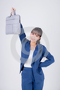 Beautiful portrait young business asian woman holding a briefcase portfolio isolated on white background