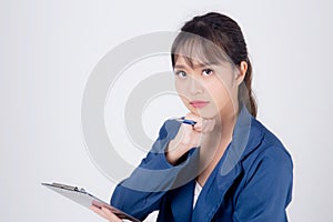 Beautiful portrait young business asian woman holding clipboard with worry and stressed about trouble of work isolated