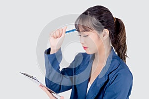 Beautiful portrait young business asian woman holding clipboard with worry and stressed about trouble of work isolated