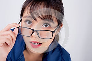 Beautiful portrait young business asian woman standing wearing glasses surprise and excited success isolated on white background