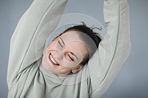Beautiful portrait of young happy cheerful 30s woman in casual sweatshirt