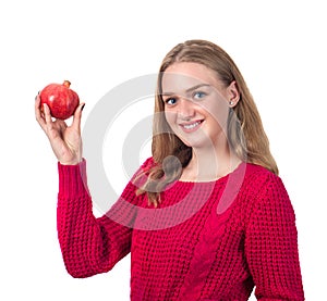 Beautiful portrait of young woman with pomegranate. Healthy food