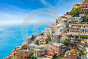 Beautiful Positano with colorful architecture on hills leading down to coast, comfortable beaches and azure sea on Amalfi Coast in