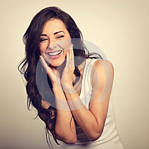Beautiful positive excited laughing young woman holding the hand