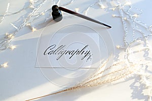 Beautiful postcard with calligraphic inscription of black ink on