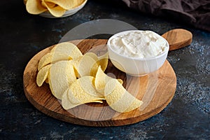 Beautiful potato chips and white sauce bowl