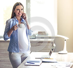 Beautiful pregnant business woman