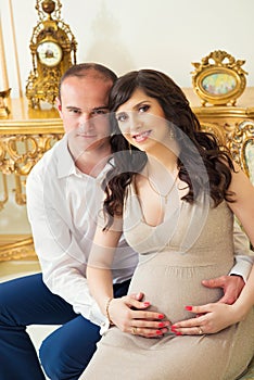 Beautiful pregnant couple expecting baby