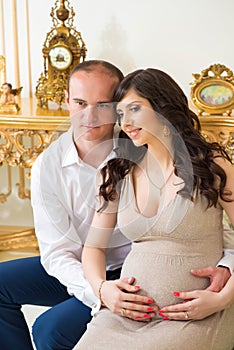 Beautiful pregnant couple expecting baby. Happy couple