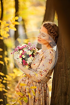 Beautiful Pregnant female in autumn