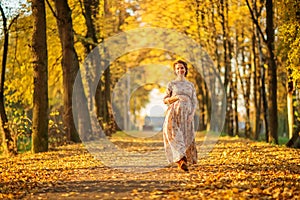 Beautiful Pregnant female in autumn