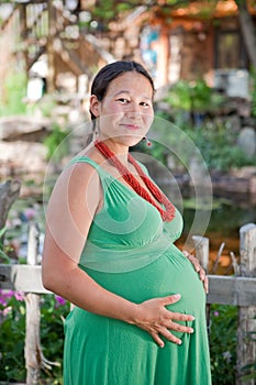 Beautiful pregnant Native American woman photo