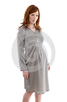 Beautiful pregnant redhead woman fashion