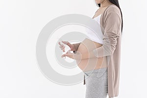 Beautiful pregnant woman applying moisturizing, stretch mark cream on belly, fertility infertility treatment, IVF, future