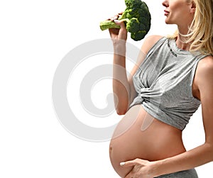 Beautiful pregnant woman big belly holding broccoli Pregnancy motherhood expectation healthy eating