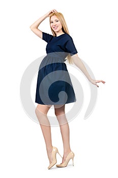 Beautiful pregnant woman in blue dress isolated on