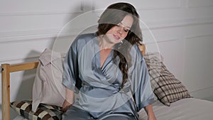 Beautiful pregnant woman cuddling in bed