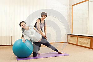 Beautiful pregnant woman doing yoga