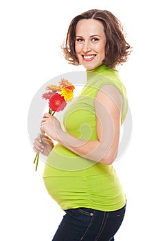 Beautiful pregnant woman with flowers